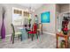 Dining room with glass table and colorful chairs at 1020 Caliva St, North Port, FL 34286