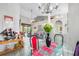 Bright dining area with glass top table and colorful chairs at 1020 Caliva St, North Port, FL 34286