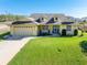 House front view with landscaping and driveway at 1020 Caliva St, North Port, FL 34286