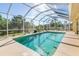 Inviting screened pool area, perfect for relaxation and entertaining at 1020 Caliva St, North Port, FL 34286