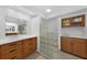 Elegant bathroom with dual vanities and a glass block shower at 1029 San Mateo Dr, Punta Gorda, FL 33950