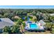 Aerial view of community pool, landscaping, and surrounding buildings at 1051 Forrest Nelson Blvd # 203, Port Charlotte, FL 33952