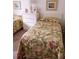 Bedroom with twin beds and tropical bedding at 1051 Forrest Nelson Blvd # 203, Port Charlotte, FL 33952