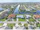 Aerial view of home on canal with neighborhood at 1075 Messina Dr, Punta Gorda, FL 33950