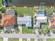 Aerial view of two canal-front homes with private pools at 1075 Messina Dr, Punta Gorda, FL 33950