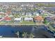 Aerial view of homes along a canal, showcasing waterfront properties at 1075 Messina Dr, Punta Gorda, FL 33950