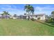 Spacious backyard with green grass and canal view at 1075 Messina Dr, Punta Gorda, FL 33950