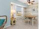 Bright dining room with table and chairs, featuring a large window at 1075 Messina Dr, Punta Gorda, FL 33950