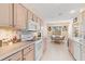 Bright kitchen with white appliances and ample counter space at 1075 Messina Dr, Punta Gorda, FL 33950