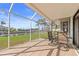 Spacious screened patio with seating area and water views at 1075 Messina Dr, Punta Gorda, FL 33950