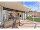 Covered patio with seating and view into living room at 1075 Messina Dr, Punta Gorda, FL 33950