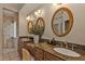 Elegant bathroom with double vanity and granite countertops at 1217 Spoonbill Dr, Punta Gorda, FL 33950