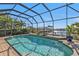 Refreshing pool with canal views and a screened enclosure at 1217 Spoonbill Dr, Punta Gorda, FL 33950