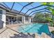 Inviting pool area with a screened enclosure and spacious patio at 1217 Spoonbill Dr, Punta Gorda, FL 33950