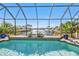 Stunning pool with canal views and a screened enclosure at 1217 Spoonbill Dr, Punta Gorda, FL 33950