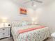 Spacious bedroom with king-size bed and floral bedding at 1259 Backspin Dr, Englewood, FL 34223