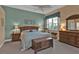 Relaxing Primary bedroom with a king-size bed and wood furniture at 13147 Preserve Ct, Port Charlotte, FL 33953