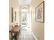 Bright entryway with tile floor, console table, and mirror at 13147 Preserve Ct, Port Charlotte, FL 33953