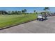 Golf carts parked near a putting green at 13147 Preserve Ct, Port Charlotte, FL 33953