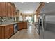 Kitchen with wood cabinets, stainless steel appliances, and breakfast nook at 13147 Preserve Ct, Port Charlotte, FL 33953