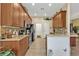 Modern kitchen featuring a breakfast bar and tile flooring at 13147 Preserve Ct, Port Charlotte, FL 33953