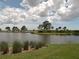 Scenic lake view with lush greenery at 13147 Preserve Ct, Port Charlotte, FL 33953