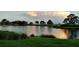 Serene lake view at sunset at 13147 Preserve Ct, Port Charlotte, FL 33953