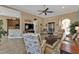 Living room with tiled floors, comfortable seating and kitchen view at 13147 Preserve Ct, Port Charlotte, FL 33953