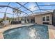 Inviting screened pool area with lounge chairs and patio furniture at 13147 Preserve Ct, Port Charlotte, FL 33953