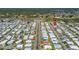 Community aerial view pinpointing a mobile home in a well-maintained neighborhood with tree-lined streets at 136 Seaward Way, North Port, FL 34287