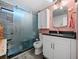 Bathroom features an updated vanity, a new toilet, and a standing glass shower at 136 Seaward Way, North Port, FL 34287