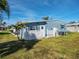 Charming single-story home with a well-maintained lawn and a classic white picket fence at 136 Seaward Way, North Port, FL 34287