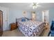 Spacious bedroom with a large bed, neutral decor, and access to the en-suite bathroom at 136 Seaward Way, North Port, FL 34287