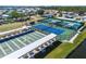 Recreational amenities including tennis and shuffleboard courts within the community at 136 Seaward Way, North Port, FL 34287