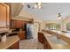 Kitchen featuring stainless appliances, dark wood cabinetry, and stone countertops at 154 Catamaraca Ct, Punta Gorda, FL 33983