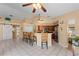 View of kitchen featuring tile floors, wicker counter seating and decorative objects at 154 Catamaraca Ct, Punta Gorda, FL 33983