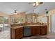 Kitchen featuring stainless appliances, dark wood cabinetry, and stone countertops at 154 Catamaraca Ct, Punta Gorda, FL 33983