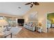 Bright living room featuring hardwood floors, comfortable seating, and a view to the bedroom at 154 Catamaraca Ct, Punta Gorda, FL 33983