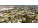 Aerial view of a neighborhood featuring many single-Gathering homes and mature trees at 154 Catamaraca Ct, Punta Gorda, FL 33983