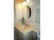 Vanity with sink and oval mirror at 1601 Park Beach Cir # 125/11, Punta Gorda, FL 33950