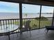 Spacious balcony with seating and a breathtaking view of the bay at 1601 Park Beach Cir # 125/11, Punta Gorda, FL 33950