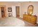 King bed, dresser and access to bathroom at 1601 Park Beach Cir # 125/11, Punta Gorda, FL 33950