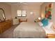 King size bed, dresser, and large mirror in bedroom at 1601 Park Beach Cir # 125/11, Punta Gorda, FL 33950