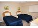 Two twin beds in a well-lit bedroom at 1601 Park Beach Cir # 125/11, Punta Gorda, FL 33950