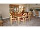 Elegant dining room with wood furniture and a built-in hutch at 1601 Park Beach Cir # 125/11, Punta Gorda, FL 33950