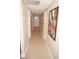 Bright hallway with tile flooring and artwork at 1601 Park Beach Cir # 125/11, Punta Gorda, FL 33950