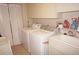 Laundry room with washer, dryer, and utility sink at 1601 Park Beach Cir # 125/11, Punta Gorda, FL 33950