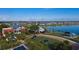 Aerial view of community clubhouse, lake, and green spaces at 16928 Curry Preserve Dr, Punta Gorda, FL 33982