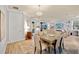 Bright dining room with a light-colored table and six chairs, located near the living room at 16928 Curry Preserve Dr, Punta Gorda, FL 33982