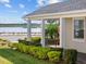 Home exterior showcasing a tranquil lake view from the porch at 16928 Curry Preserve Dr, Punta Gorda, FL 33982